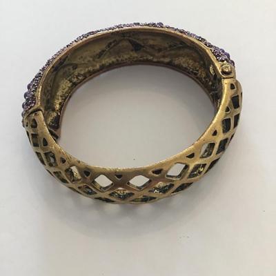 Gold tone purple clamp bracelet