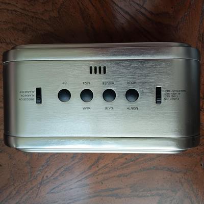 ALARM CLOCK WITH CALENDAR, PORTABLE READER SYSTEM AND A SURGE TAP