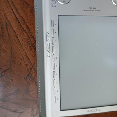 ALARM CLOCK WITH CALENDAR, PORTABLE READER SYSTEM AND A SURGE TAP