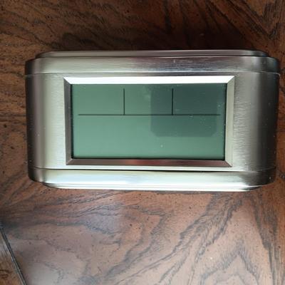 ALARM CLOCK WITH CALENDAR, PORTABLE READER SYSTEM AND A SURGE TAP