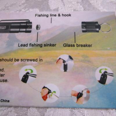 Sale Photo Thumbnail #125: Survival has a glass breaker, fishing line hook & sinker, lighter, cutter