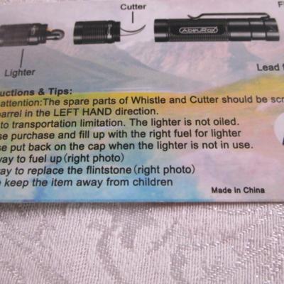 Sale Photo Thumbnail #126: Survival has a glass breaker, fishing line hook & sinker, lighter, cutter