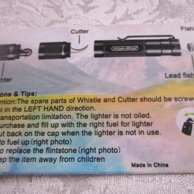 Sale Photo Thumbnail #124: Survival has a glass breaker, fishing line hook & sinker, lighter, cutter