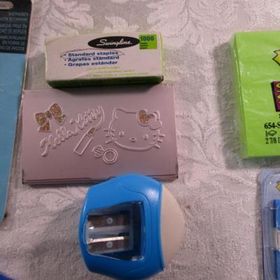 Sale Photo Thumbnail #266: Note pads, #10 envelopes, post-it notes, staples, Helllo Kitty business card holder, bookmark, tablet, post-it flags, scissors, paper clips, pencil sharpener, license plate name plate, stylus