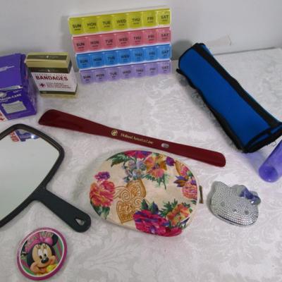 Sale Photo Thumbnail #395: Box gauze pads, bandages, pill organizer, stomach wrap up to 39", shoe horn, mirror, makeup bag, Hello Kitty compact mirror, 3 oz travel bottle, Minnie Mouse pin