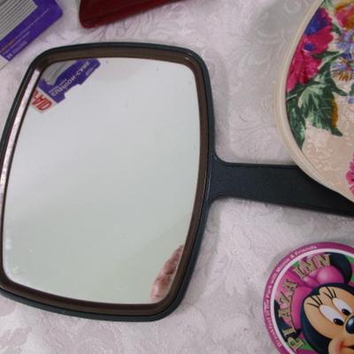 Sale Photo Thumbnail #405: Box gauze pads, bandages, pill organizer, stomach wrap up to 39", shoe horn, mirror, makeup bag, Hello Kitty compact mirror, 3 oz travel bottle, Minnie Mouse pin