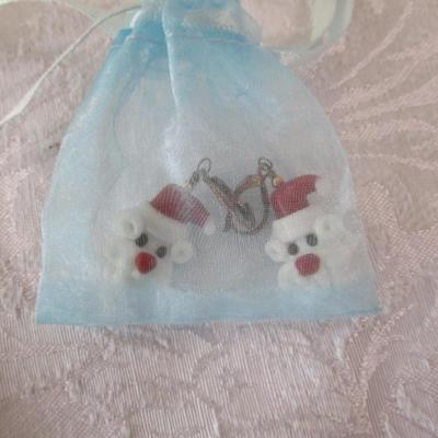 Sale Photo Thumbnail #418: String backpack, mug, Santa earrings, gift labels, new small string of lights (take 2 AA batteries not included), large Pez container, round Christmas tin, 2 ornaments