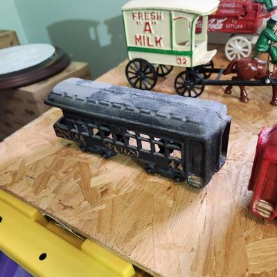 Lot of 7 Cast Iron Toys Milk Wagon, Truck, U.S. Mail, Produce Wagon, Carriage, Coca-Cola Wagon, P.R.R. Train Set
