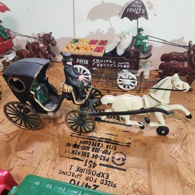 Lot of 7 Cast Iron Toys Milk Wagon, Truck, U.S. Mail, Produce Wagon, Carriage, Coca-Cola Wagon, P.R.R. Train Set