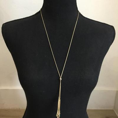 Very nice vintage gold toned, green rhinestone slider tassel necklace very beautiful. Very nice.