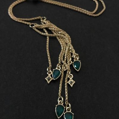 Very nice vintage gold toned, green rhinestone slider tassel necklace very beautiful. Very nice.