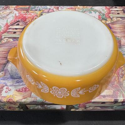 Pyrex casserole dish in the Butterfly Gold pattern.