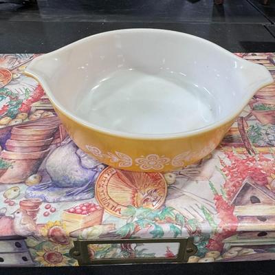 Pyrex casserole dish in the Butterfly Gold pattern.