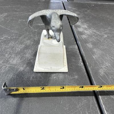 Metal goose in flight statue