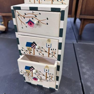 Cabinet or jewelry box featuring a hand-painted birdhouse and bird design