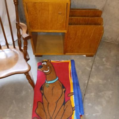 A CHILD'S ROCKING CHAIR, SCOOBY DOO BLANKET AND A SIDE TABLE WITH CABINET AND MAGAZINE HOLDER
