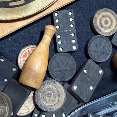 Dominos with wooden pegs, and cardboard horse shoes.