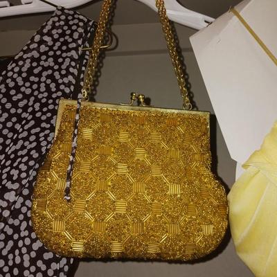EVENING DRESSES AND A GOLD PURSE