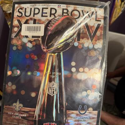 Uncirculated Sports Illustrated and Saints Super Bowl program