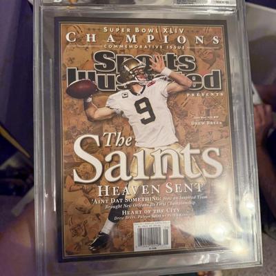 Uncirculated Sports Illustrated and Saints Super Bowl program