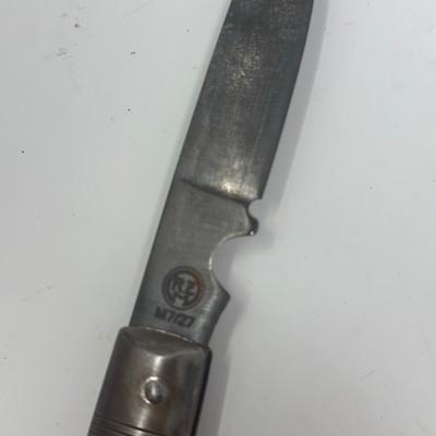 Sale Photo Thumbnail #435: Puma Solingen German WWII pocket knife. It has a wood handle and an eagle with swastika emblem attached. Very good condition.