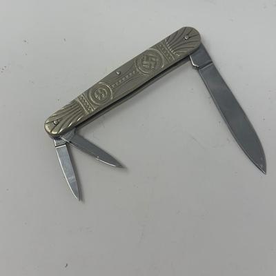 Sale Photo Thumbnail #461: In like new condition. Pre WWII elections SS pocket knife with embossed swastika and SS symbols.