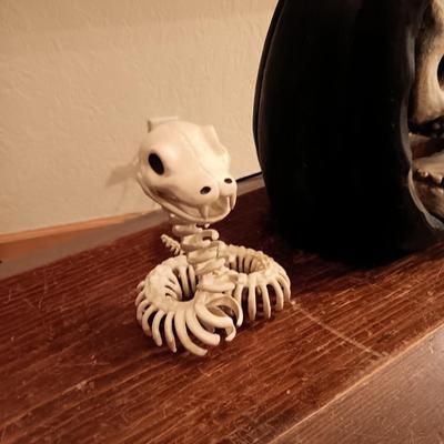 FAUX FLAME SKULL PUMPKIN, CROW AND A SKELETON SNAKE