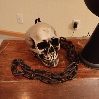 FAUX FLAME TORCH AND 2 SKULL ON CHAINS