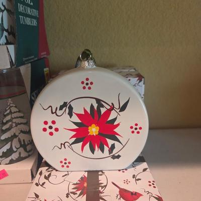 Sale Photo Thumbnail #93: Christmas decor
Dishes
Placemats
Serving pieces
3 poinsettia glass ornaments 

Table & shelves not included
