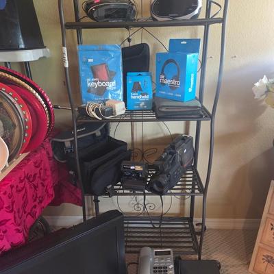 Sale Photo Thumbnail #109: Tv - 25”
DVD player
Alarm clocks
Computer accessories 
Video camera
Headphones

Bakers rack not included