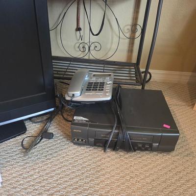 Sale Photo Thumbnail #113: Tv - 25”
DVD player
Alarm clocks
Computer accessories 
Video camera
Headphones

Bakers rack not included