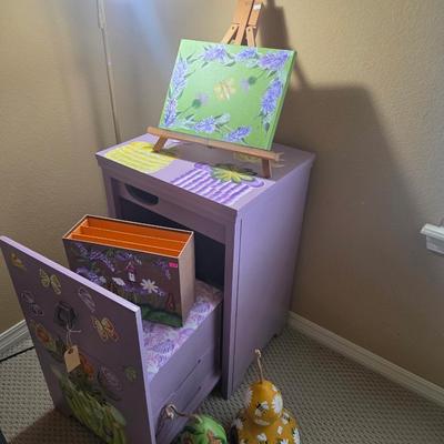 Sale Photo Thumbnail #291: Painted cabinet - 31” tall, 21” wide
Has its own seat with drawers
Small easel
Painted gourds
File box