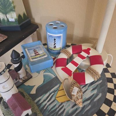 Sale Photo Thumbnail #316: Picture - 23x36
Mirror - 21x27
Square table - 14x24 1/2, 22 1/2” tall
Lighthouse table - 21” tall
