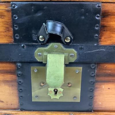 Sale Photo Thumbnail #462: Has brass key lock, front leather strap is torn 
Inside has been completely restored 
 Measures: 20.5" high x 32.5" wide x 19.75" deep