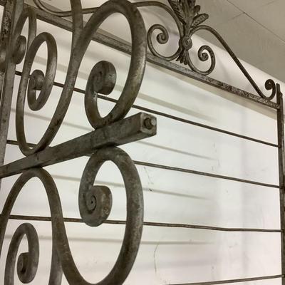 Sale Photo Thumbnail #495: This solid French bakers rack by dated from circa 1890-1910 is made of iron and wrapped in unlaquered brass trim by Echalie and Biabaud, Paris embossed on the cast iron feet. Scroll iron decor, sheaves of wheat adorn the top. The left side of this rack sl