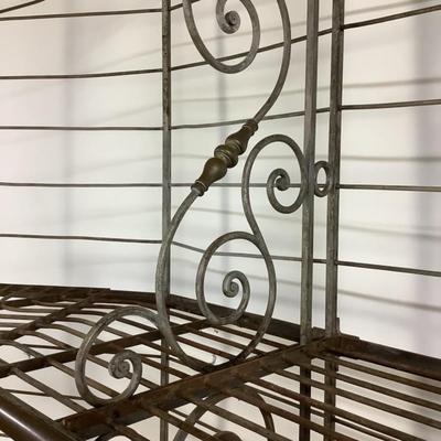Sale Photo Thumbnail #485: This solid French bakers rack by dated from circa 1890-1910 is made of iron and wrapped in unlaquered brass trim by Echalie and Biabaud, Paris embossed on the cast iron feet. Scroll iron decor, sheaves of wheat adorn the top. The left side of this rack sl