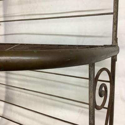 Sale Photo Thumbnail #494: This solid French bakers rack by dated from circa 1890-1910 is made of iron and wrapped in unlaquered brass trim by Echalie and Biabaud, Paris embossed on the cast iron feet. Scroll iron decor, sheaves of wheat adorn the top. The left side of this rack sl