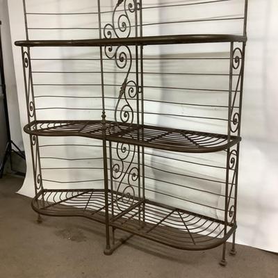 Sale Photo Thumbnail #492: This solid French bakers rack by dated from circa 1890-1910 is made of iron and wrapped in unlaquered brass trim by Echalie and Biabaud, Paris embossed on the cast iron feet. Scroll iron decor, sheaves of wheat adorn the top. The left side of this rack sl