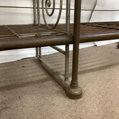 Sale Photo Thumbnail #490: This solid French bakers rack by dated from circa 1890-1910 is made of iron and wrapped in unlaquered brass trim by Echalie and Biabaud, Paris embossed on the cast iron feet. Scroll iron decor, sheaves of wheat adorn the top. The left side of this rack sl