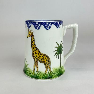 Sale Photo Thumbnail #529: Comes with hand-painted giraffe mug, an all white mug, and a gold trim all Tiffany & co. 
Measurement of giraffe mug is 4.5” in height