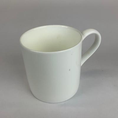 Sale Photo Thumbnail #528: Comes with hand-painted giraffe mug, an all white mug, and a gold trim all Tiffany & co. 
Measurement of giraffe mug is 4.5” in height