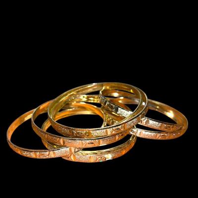 8 Gold tone bangles