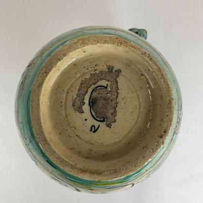 Sale Photo Thumbnail #584: Has a crack/repair at the mouth of the pitcher, signed at the bottom
Measurements:
11” in height, 7” in diameter