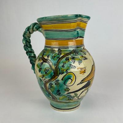 Sale Photo Thumbnail #580: Has a crack/repair at the mouth of the pitcher, signed at the bottom
Measurements:
11” in height, 7” in diameter