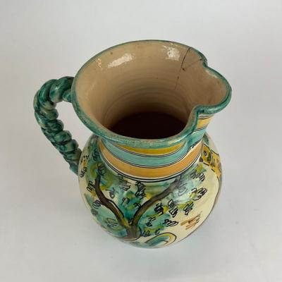 Sale Photo Thumbnail #583: Has a crack/repair at the mouth of the pitcher, signed at the bottom
Measurements:
11” in height, 7” in diameter