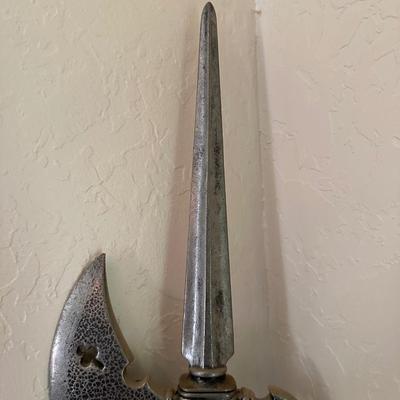 A HALBERD, A TWO-HANDED POLE WEAPON