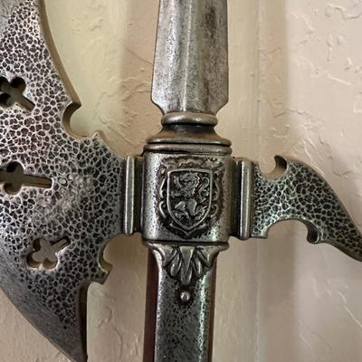A HALBERD, A TWO-HANDED POLE WEAPON