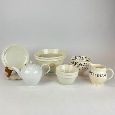 Sale Photo Thumbnail #714: Comes with a mixing bowls, bowls, a creamer, fruit bowls, tea pot, and dessert plates.
Measurements:
Mixing bowl is 5” in height, 8” in diameter