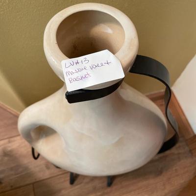 Vase in black metal holder