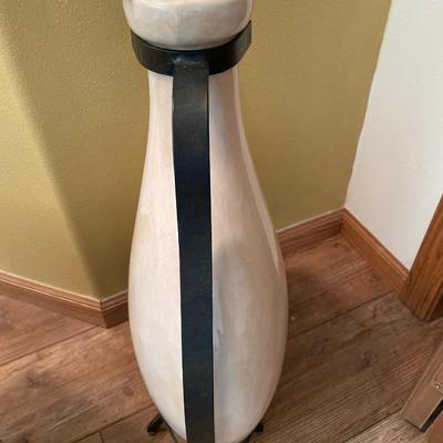 Vase in black metal holder